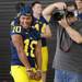 Michigan junior wide receiver Jeremy Gallon goofs around as he attempts to distract junior quarterback Devin Gardner as he has his photo taken during media day at the Al Glick Field House on Sunday afternoon. Melanie Maxwell I AnnArbor.com